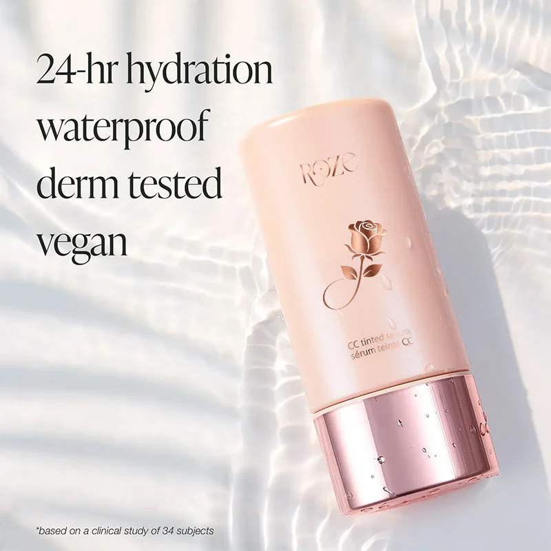 Model blending color-correcting tinted serum into skin